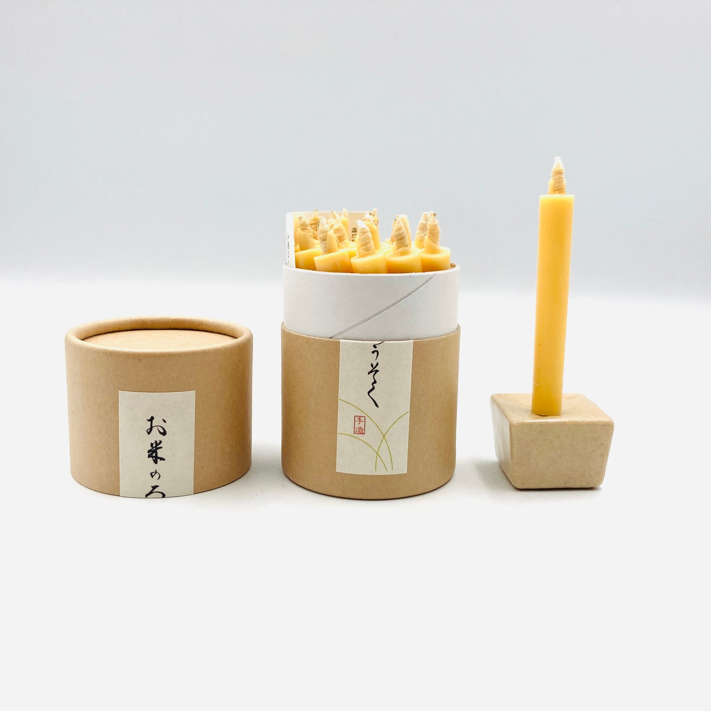 20 Reiswachskerzen mit Keramikständer